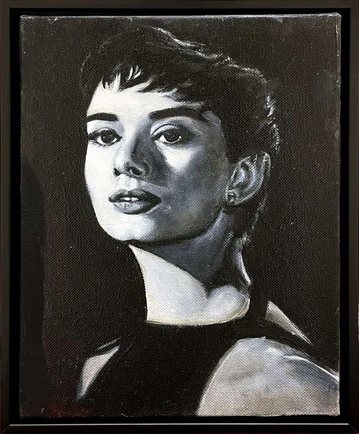 Black-and-white portrait with strong chiaroscuro.