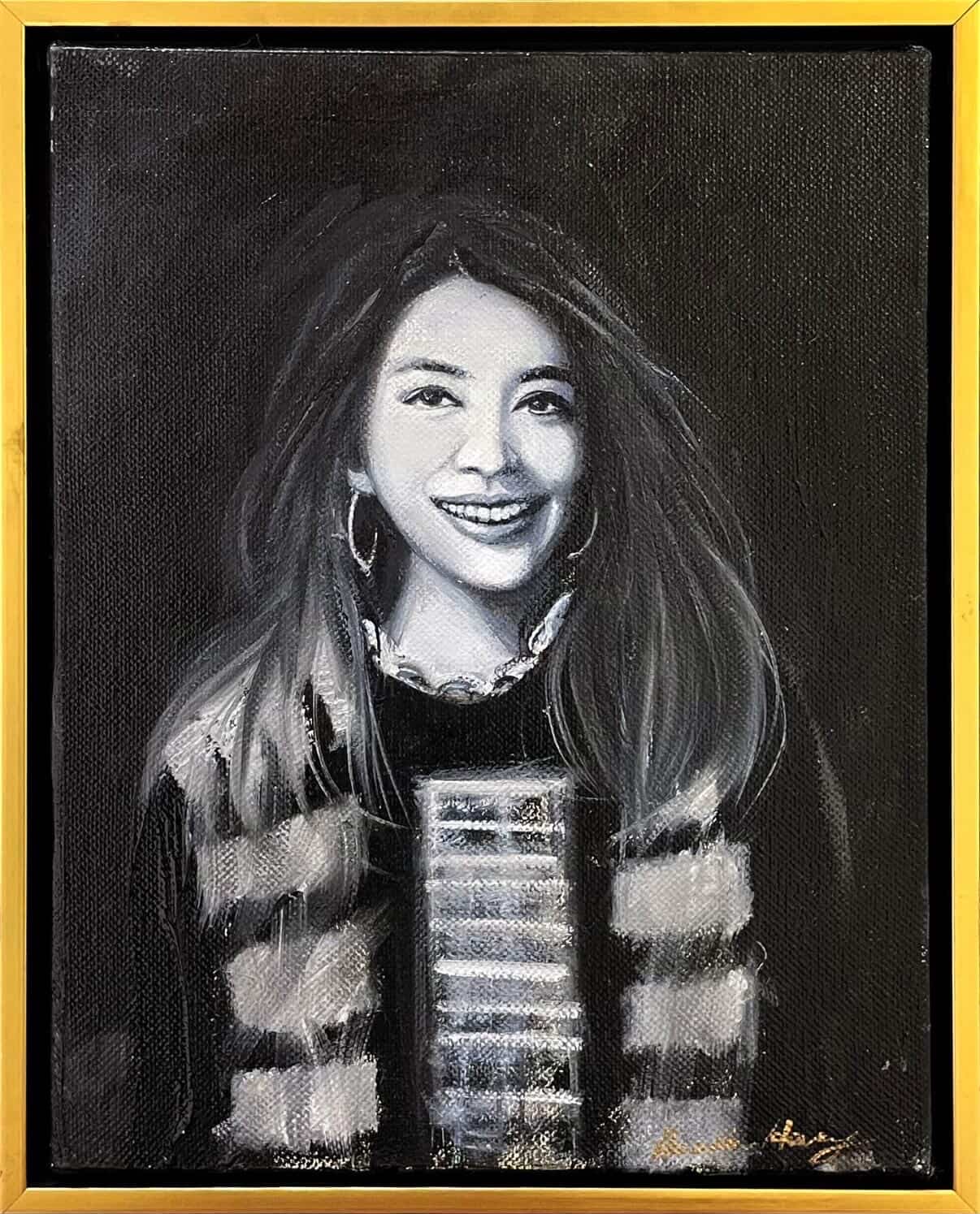 Monochrome portrait of a smiling woman with patterned dress.